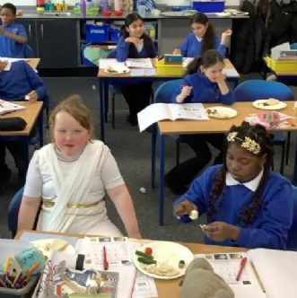 Photo of children tasting Greek Food